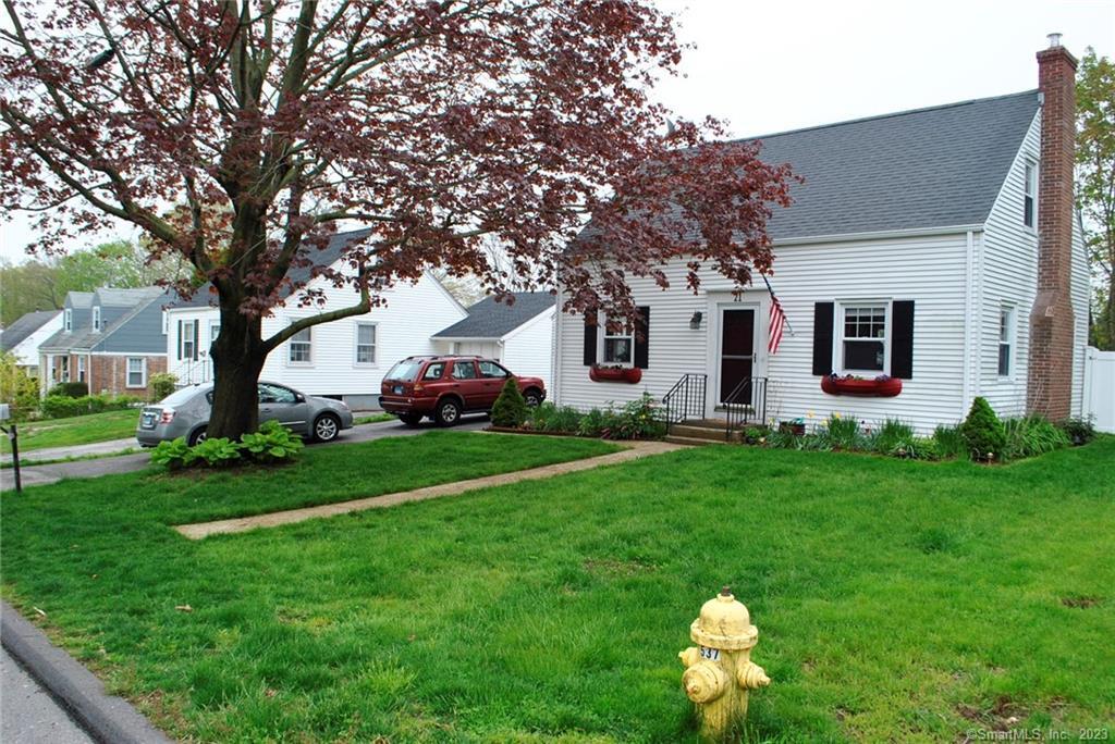 21 Country Club Road Groton, CT 06340 - Photo 1 of 1 a front view of house with yard and green space