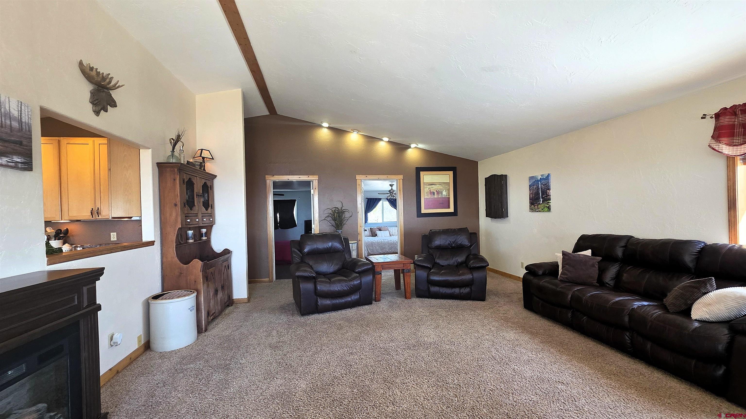 21976 2225th Road Cedaredge, CO 81413 - Photo 11 of 36 a living room with furniture and a flat screen tv