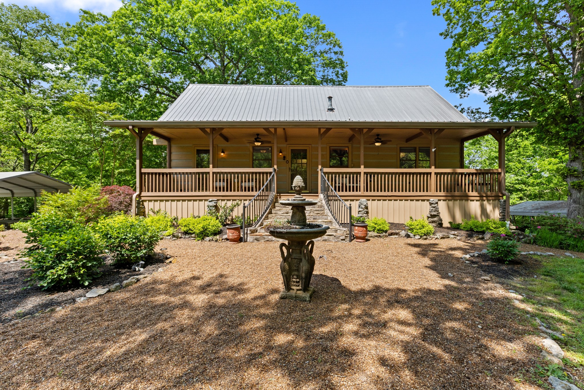 a front view of a house with garden