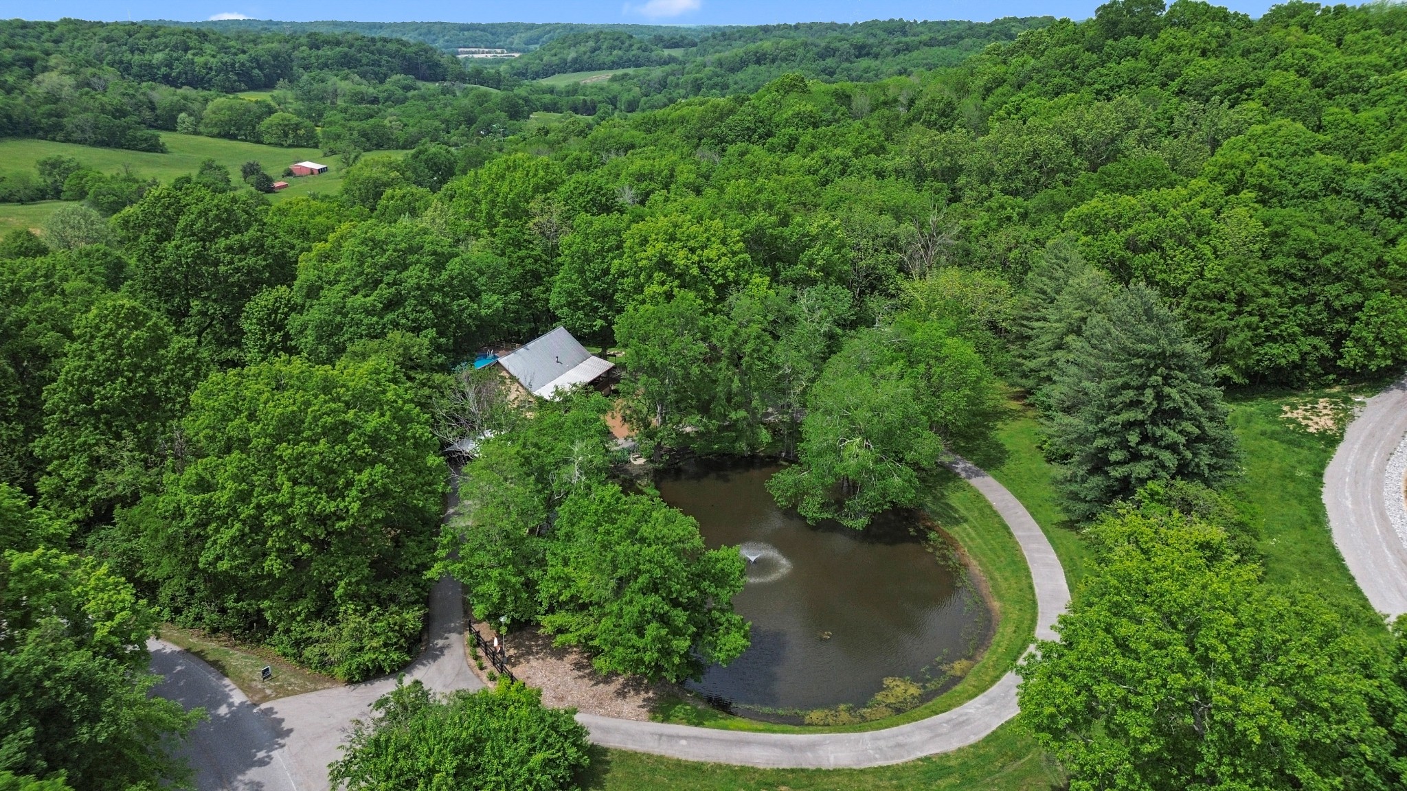 1708 Sugar Ridge Road Spring Hill, TN 37174 - Photo 4 of 59 a view of a garden with a house
