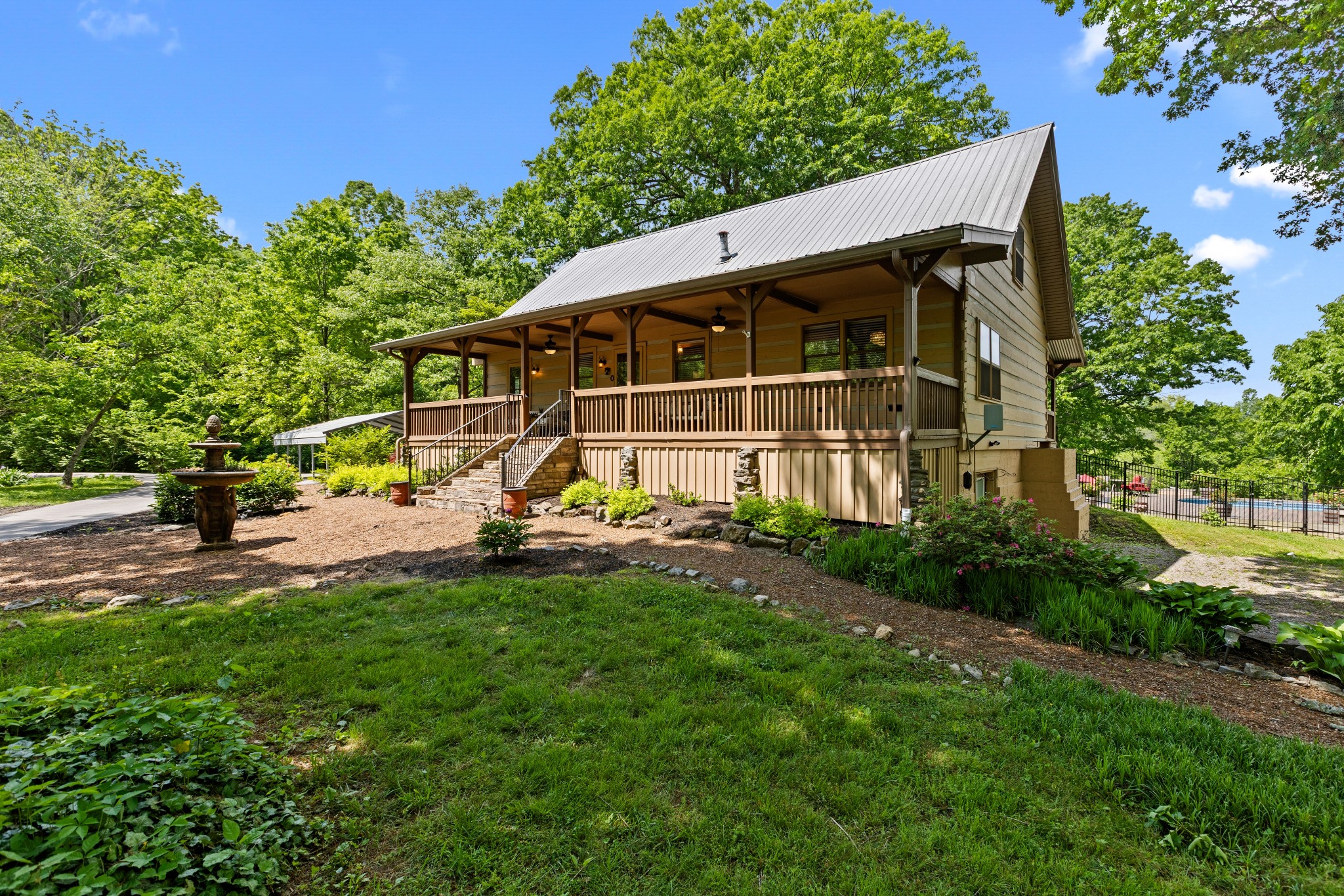 1708 Sugar Ridge Road Spring Hill, TN 37174 - Photo 6 of 59 a view of a house with backyard sitting area and garden