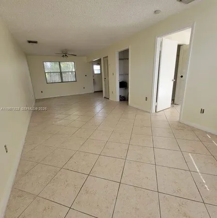 a view of a livingroom and window