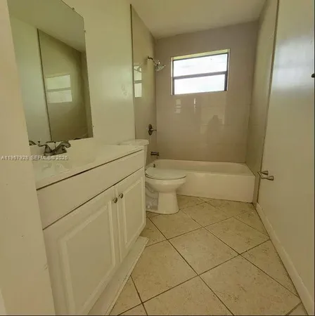 a view of street with a car parked on the road