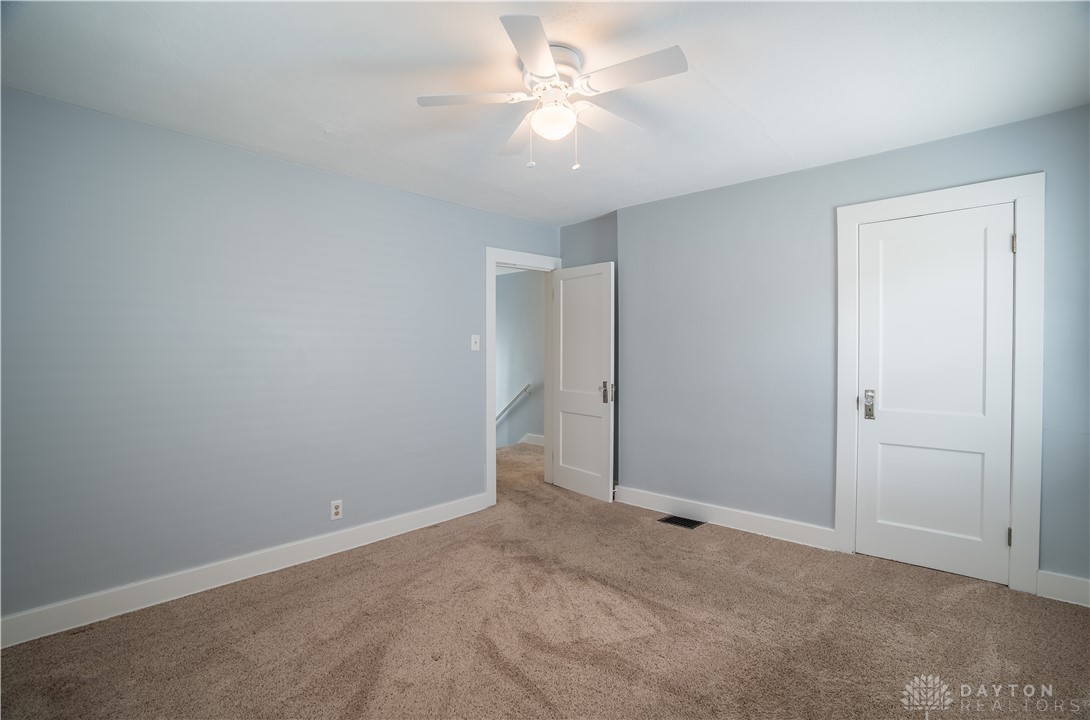 303 South Ridge Avenue Troy, OH 45373 - Photo 19 of 37 Bright and airy room with inviting carpet and crisp white trim.