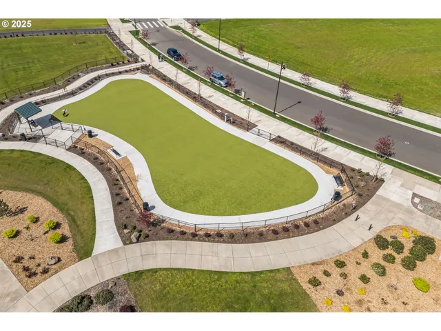 a view of swimming pool with a garden and seating area