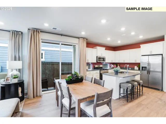 a kitchen with a table and chairs