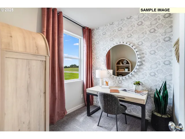 a dining room with furniture and a window