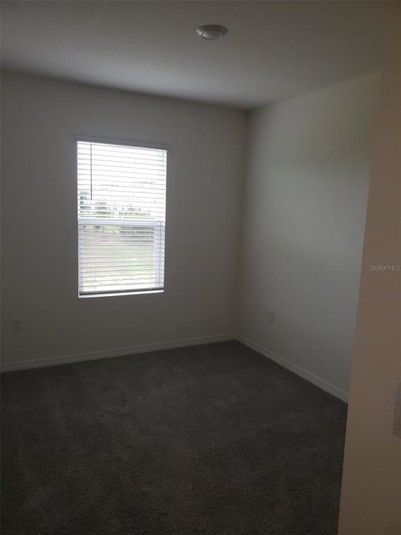 1670 Rock Elm Road Davenport, FL 33837 - Photo 17 of 28 an empty room with a window