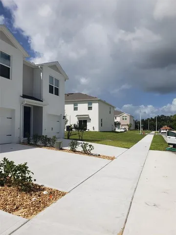 a view of a house with a street