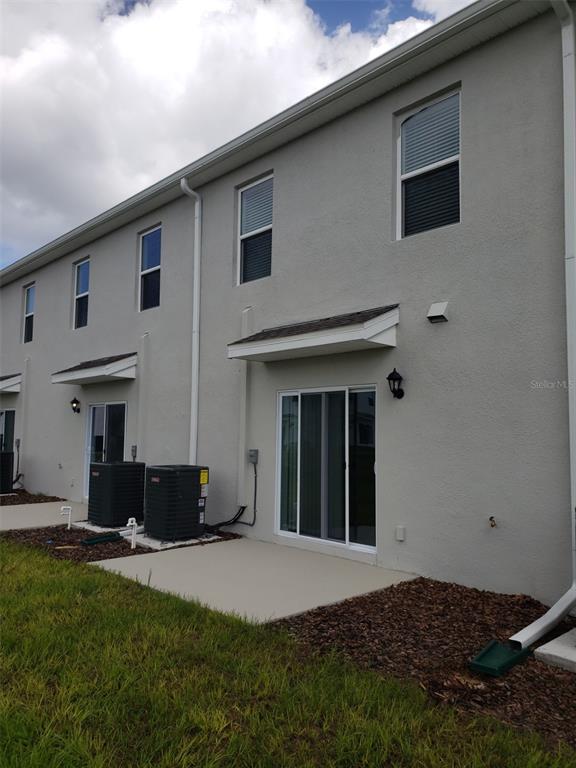 1670 Rock Elm Road Davenport, FL 33837 - Photo 23 of 28 a house view with a garden space