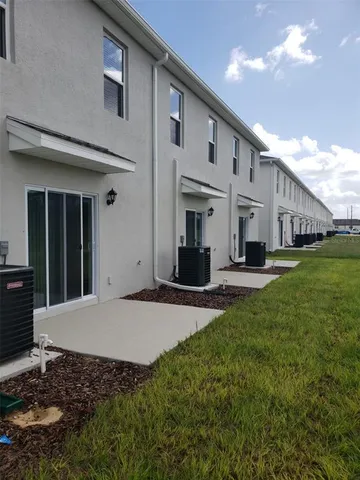 a view of a terrace with yard