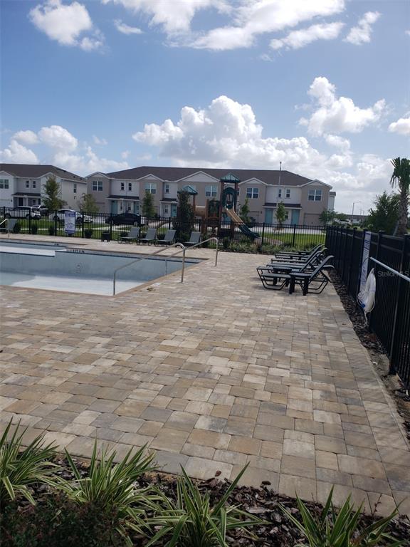 1670 Rock Elm Road Davenport, FL 33837 - Photo 25 of 28 a view of a terrace with yard