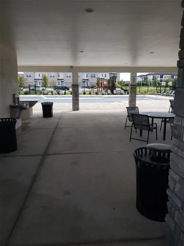 a view of a garden with wooden fence