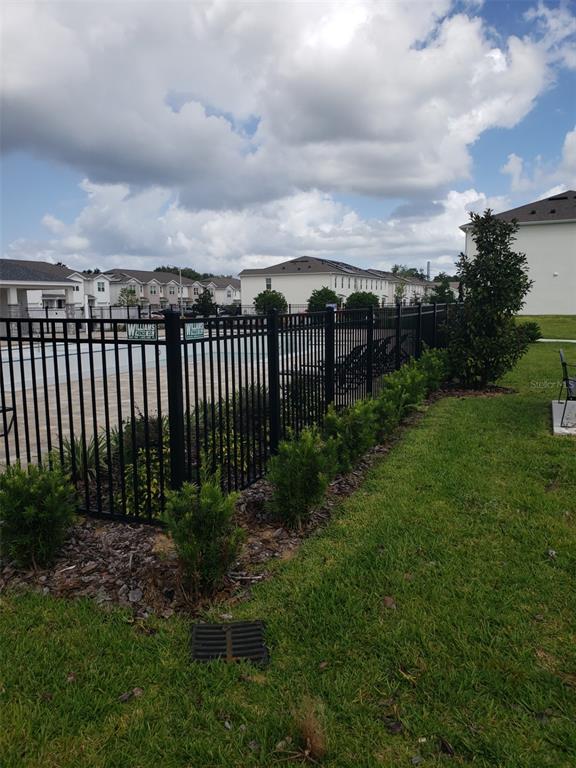 1670 Rock Elm Road Davenport, FL 33837 - Photo 27 of 28 a view of a garden with wooden fence