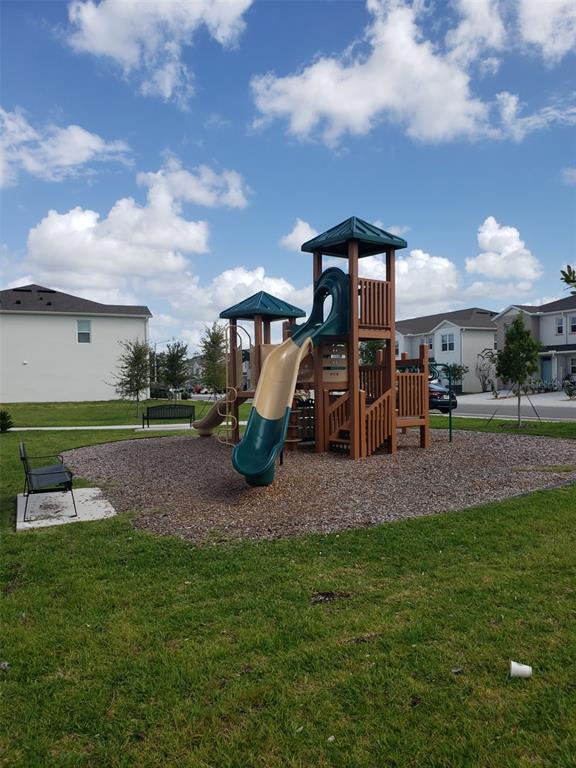 1670 Rock Elm Road Davenport, FL 33837 - Photo 28 of 28 a childrens park with lots of swings and slides