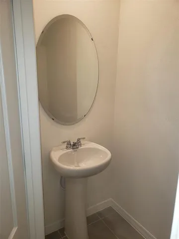 a white toilet sitting next to a shower