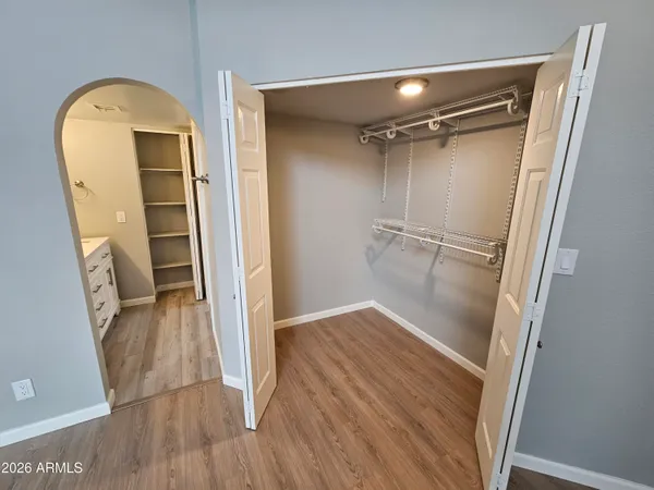 a bathroom with a double vanity sink and mirror