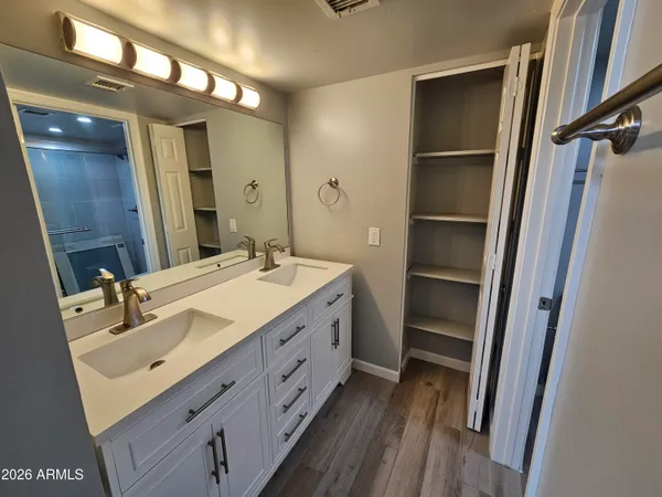 a bathroom with a toilet sink and shower