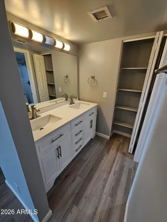 a white toilet sitting next to a bathroom sink