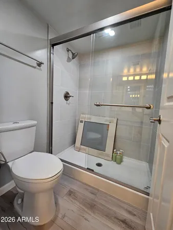 a view of a bathroom from a hallway