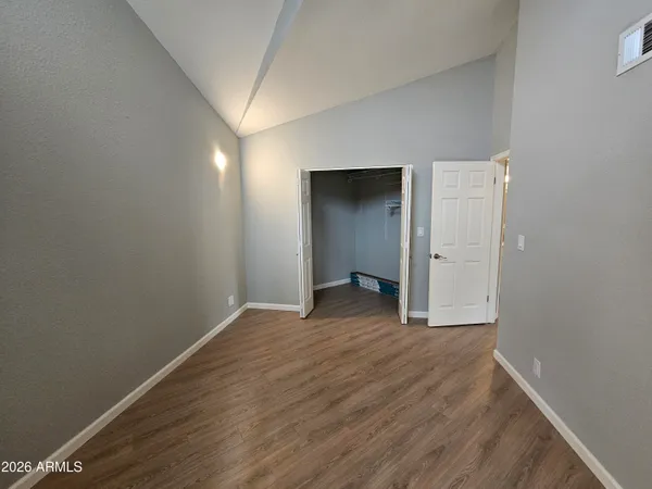 a bedroom with a bed and a couch