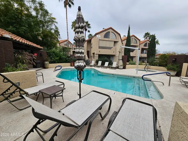 a view of a patio with swimming pool