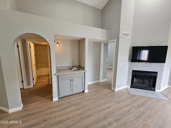 a view of a kitchen cabinets and wooden floor