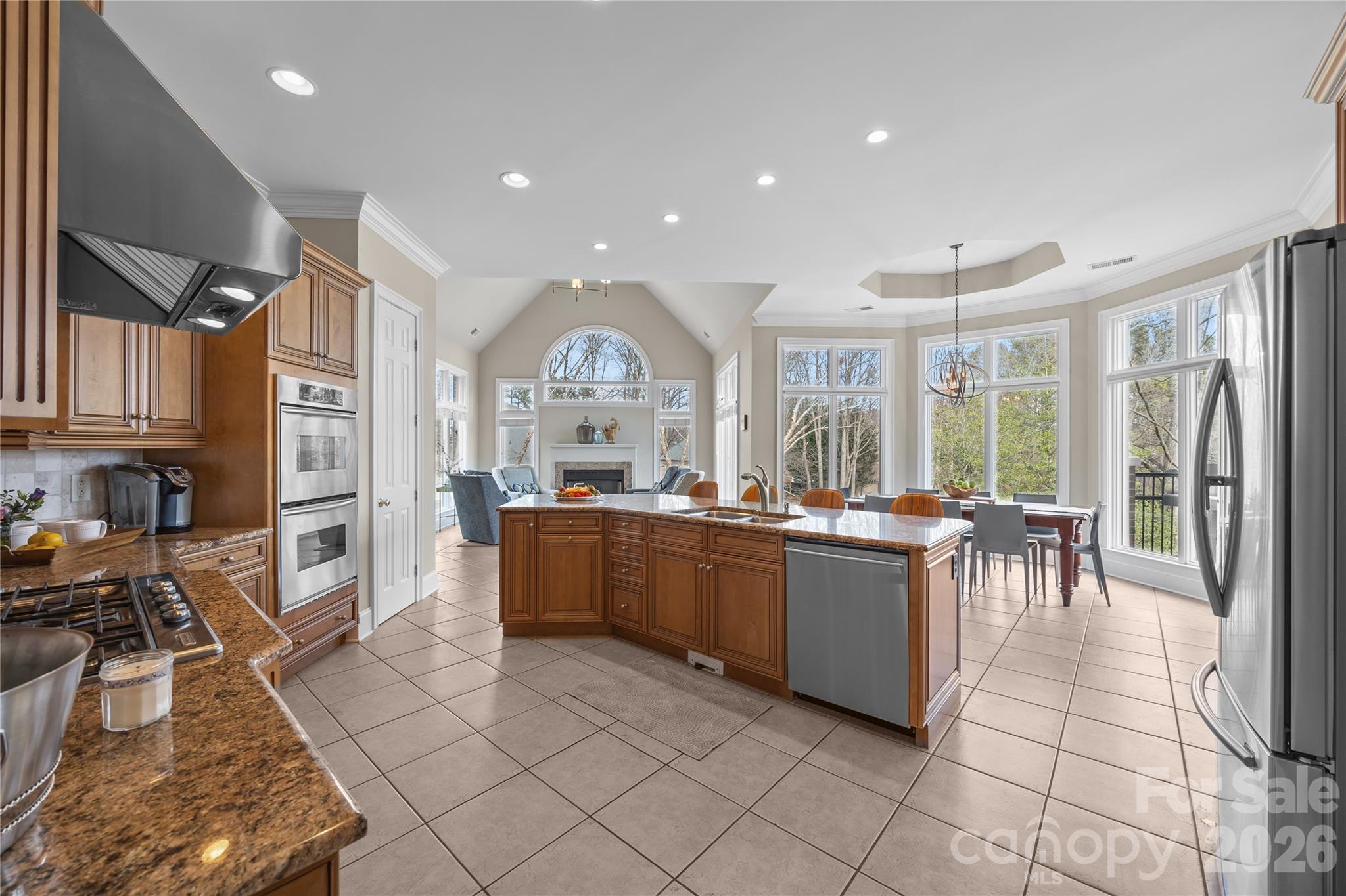 8052 Westbay Road Denver, NC 28037 - Photo 13 of 45 a kitchen with lots of counter top space and stainless steel appliances