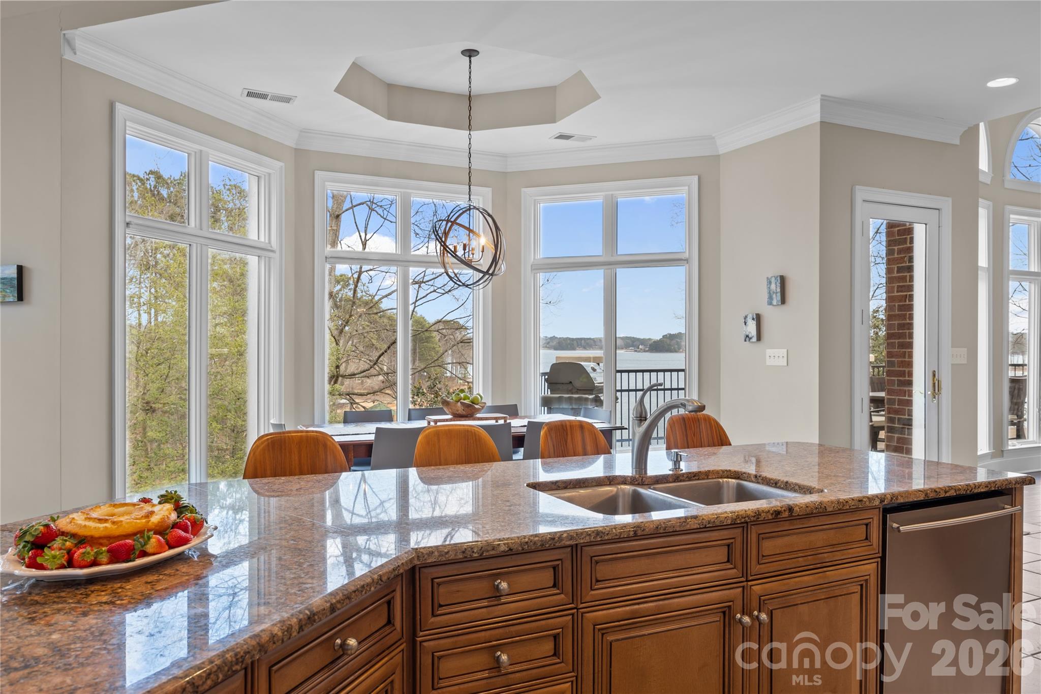 8052 Westbay Road Denver, NC 28037 - Photo 14 of 45 a view of a kitchen with granite countertop a large window cabinets and stainless steel appliances