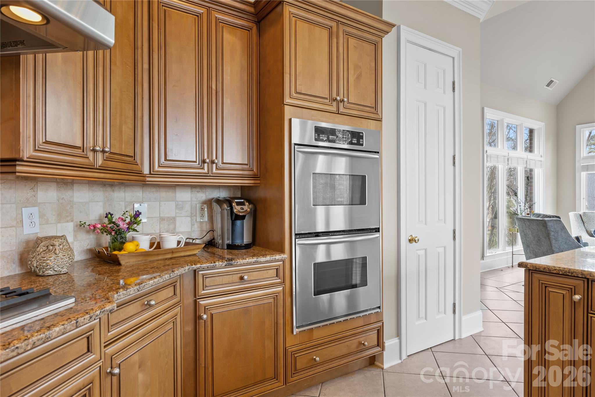 8052 Westbay Road Denver, NC 28037 - Photo 15 of 45 a kitchen with stainless steel appliances granite countertop a refrigerator and cabinets