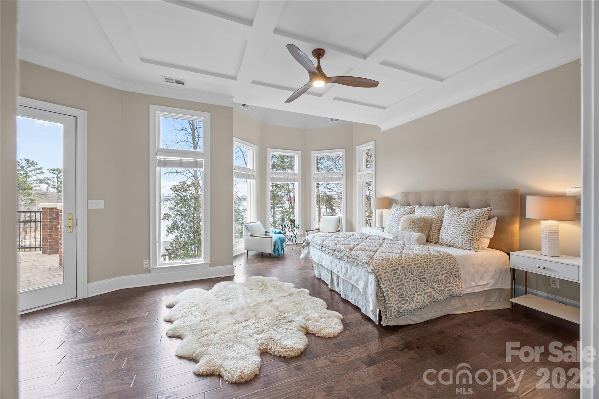 8052 Westbay Road Denver, NC 28037 - Photo 18 of 45 a spacious bedroom with a large bed and a large window