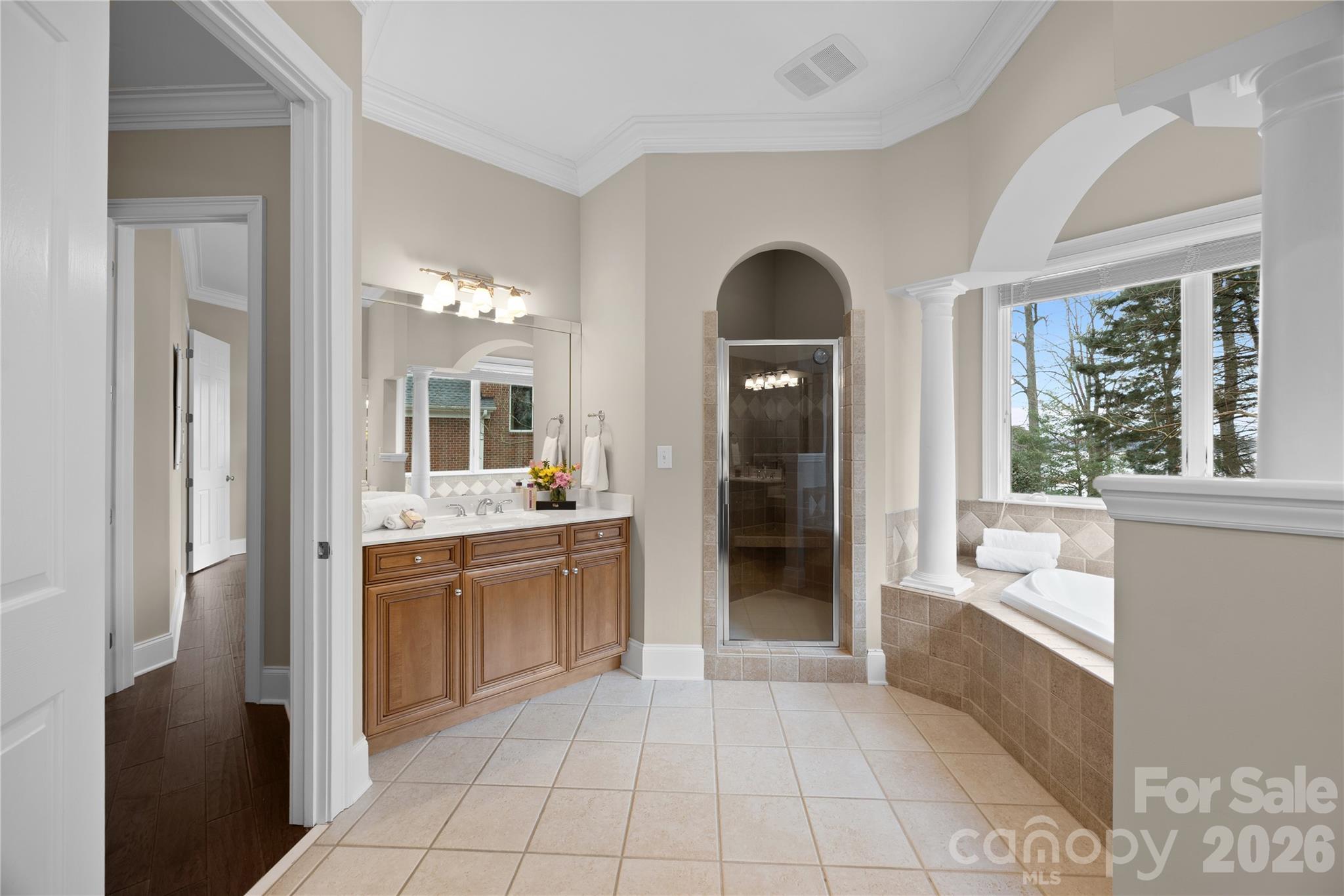 8052 Westbay Road Denver, NC 28037 - Photo 21 of 45 a bathroom with a tub sink and mirror