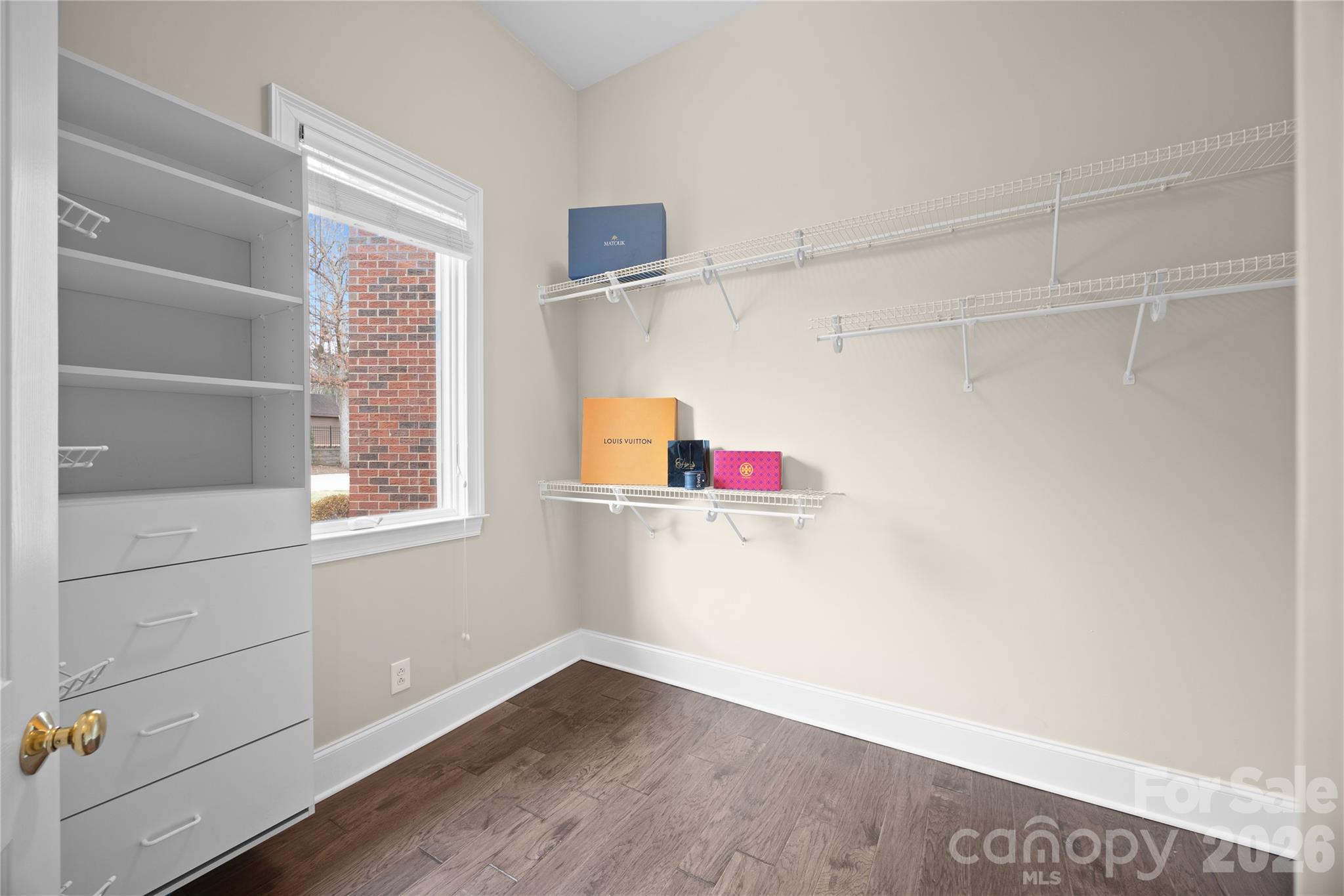 8052 Westbay Road Denver, NC 28037 - Photo 22 of 45 a view of walk in closet with clothes and shoes