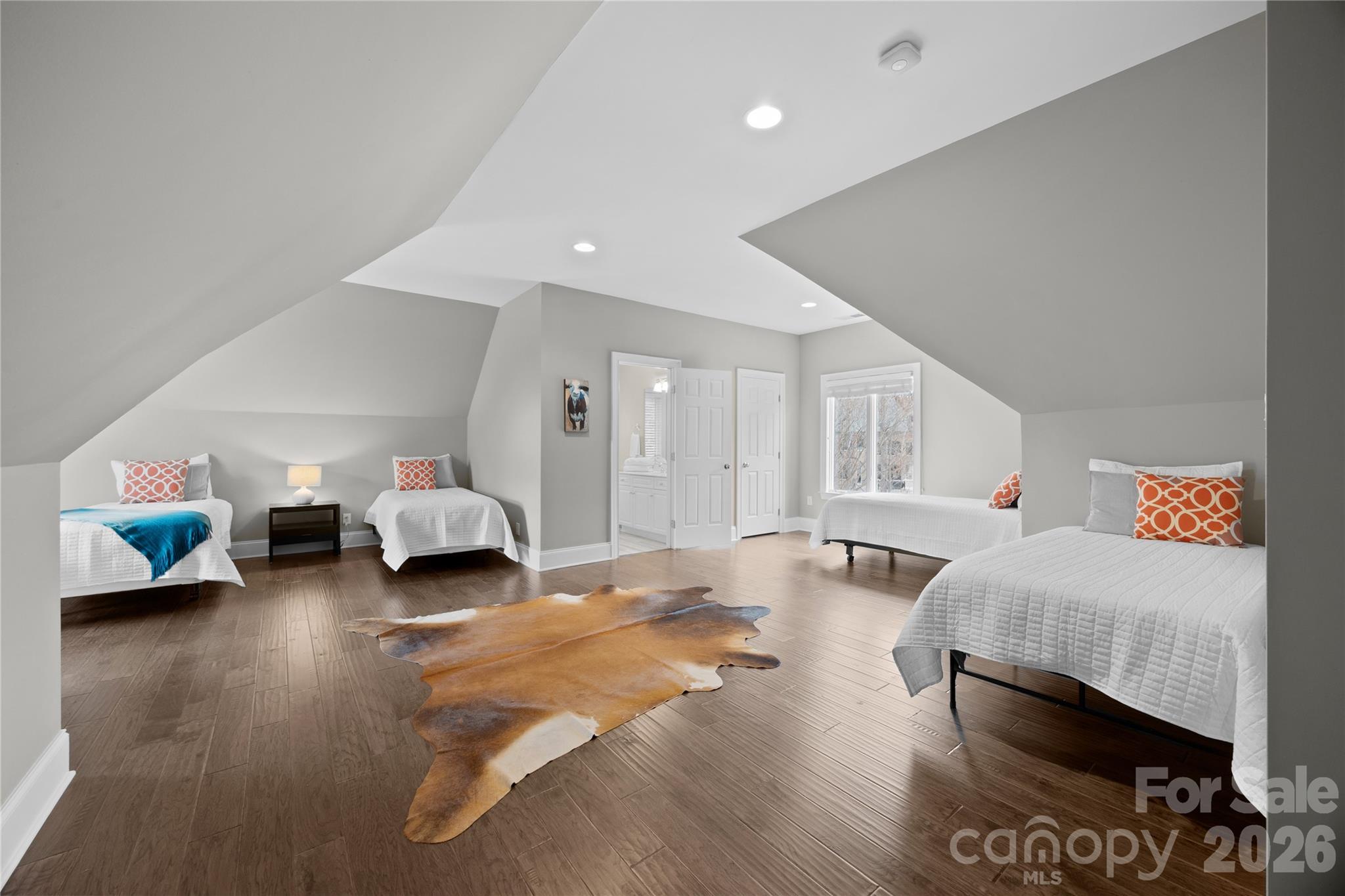 8052 Westbay Road Denver, NC 28037 - Photo 23 of 45 a spacious bedroom with a bed and a couch