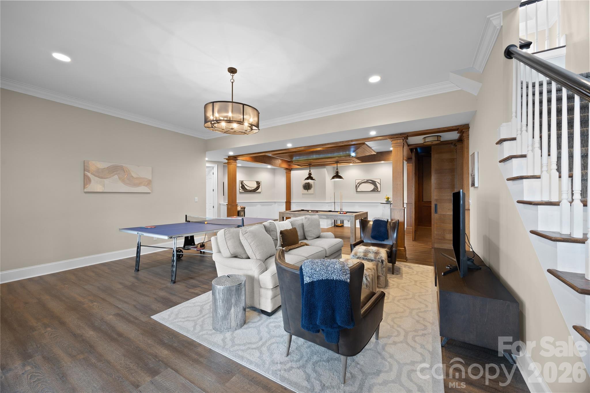 8052 Westbay Road Denver, NC 28037 - Photo 25 of 45 a living room with furniture chandelier and a table