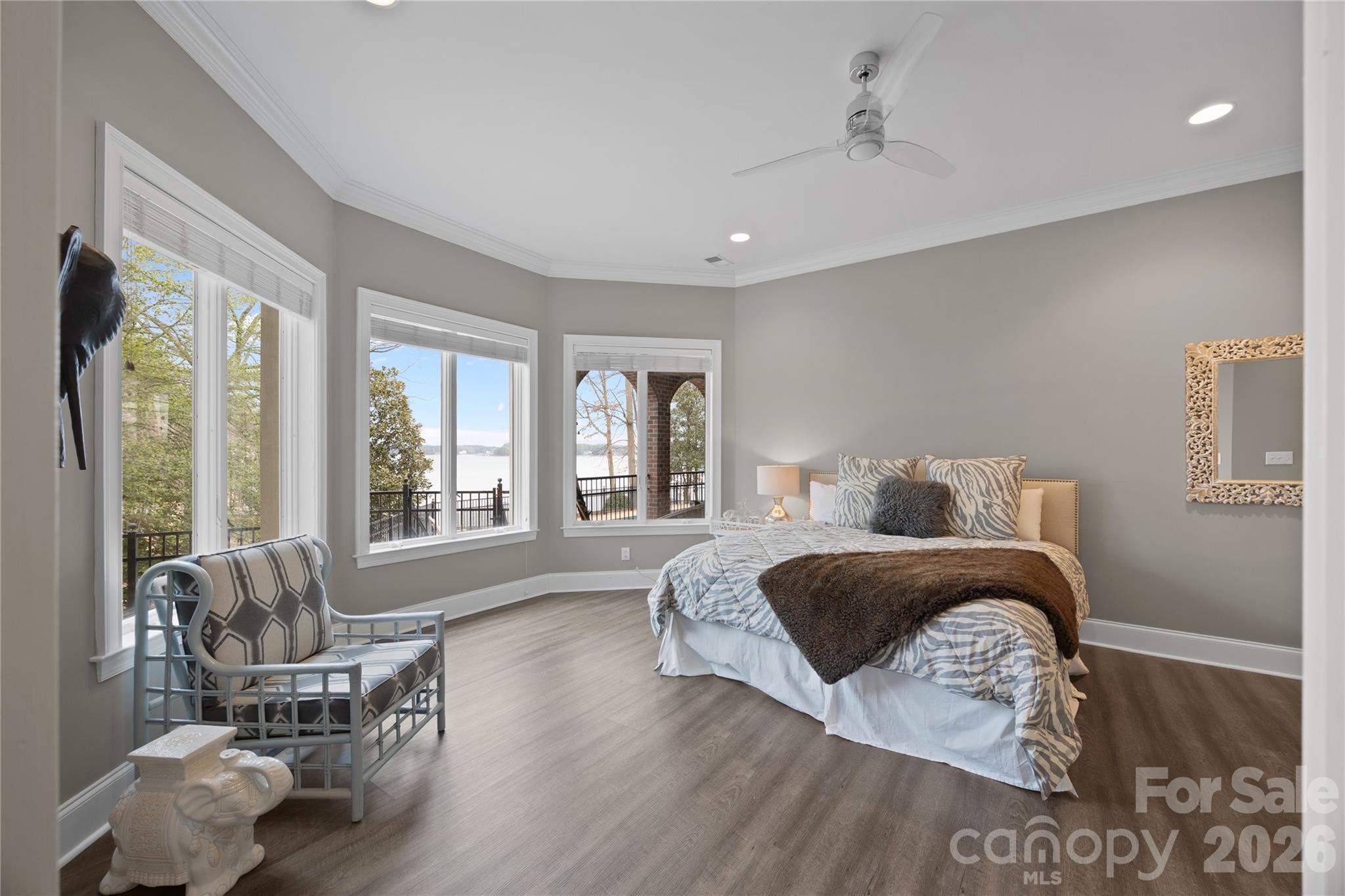 8052 Westbay Road Denver, NC 28037 - Photo 30 of 45 a spacious bedroom with a bed and wooden floor
