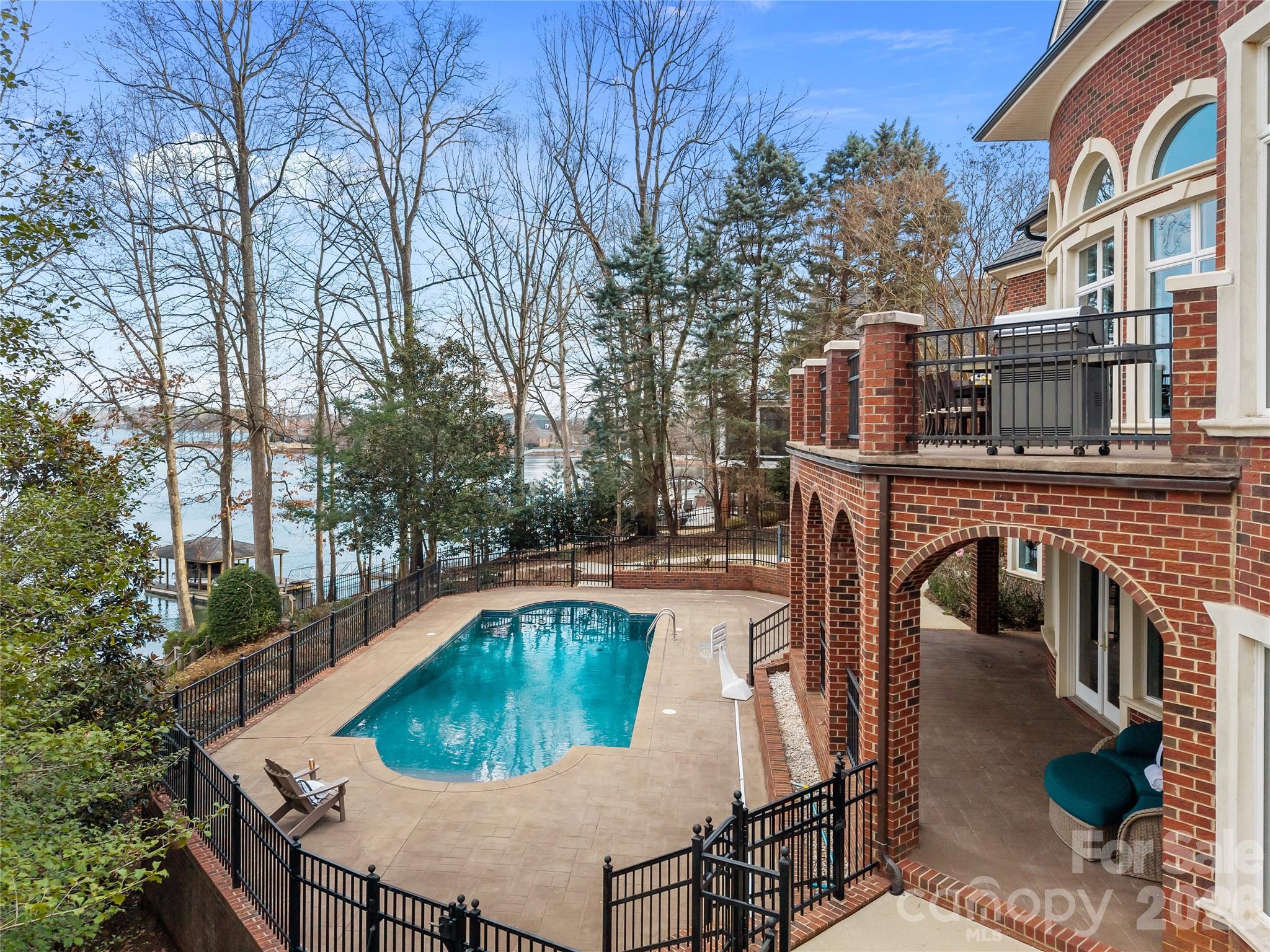 8052 Westbay Road Denver, NC 28037 - Photo 35 of 45 a view of a swimming pool with a patio