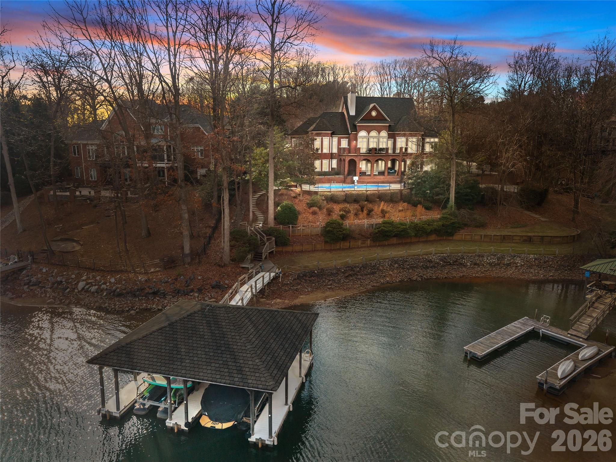 8052 Westbay Road Denver, NC 28037 - Photo 4 of 45 a view of a house with a yard from a lake