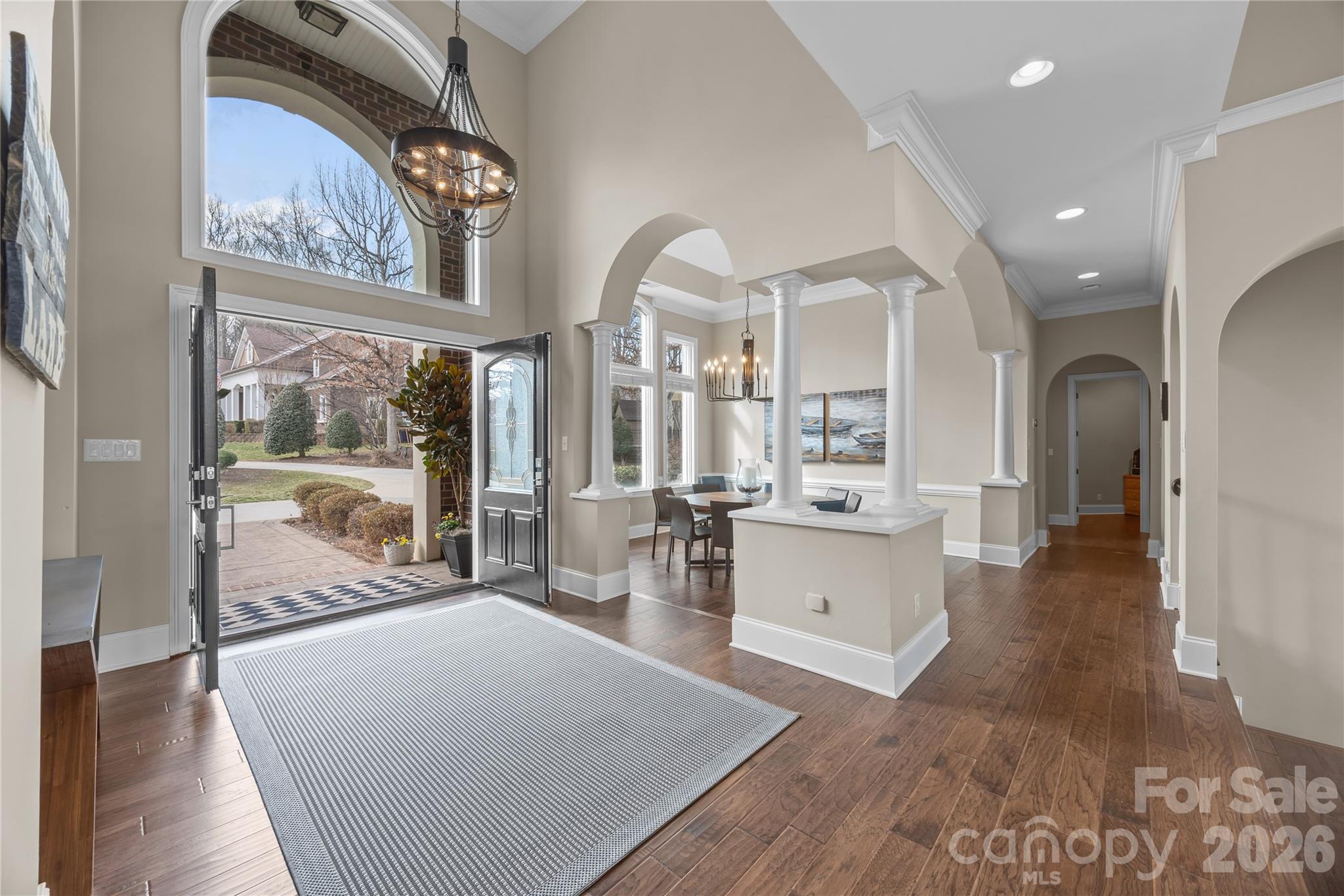 8052 Westbay Road Denver, NC 28037 - Photo 6 of 45 a large living room with stainless steel appliances wooden floor and a large window