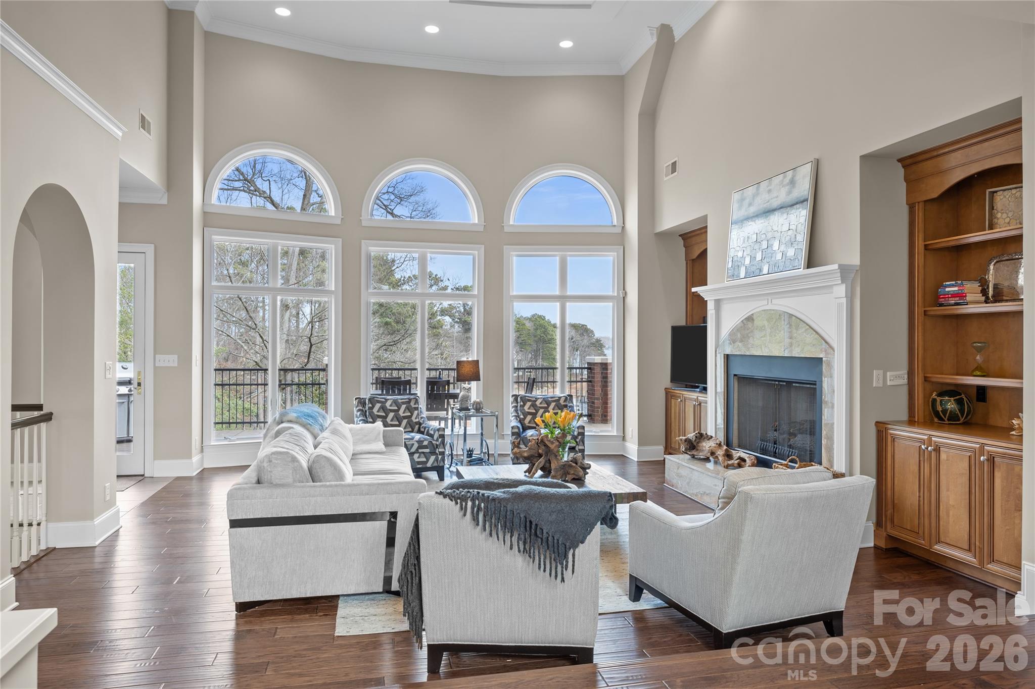 8052 Westbay Road Denver, NC 28037 - Photo 8 of 45 a living room with fireplace furniture and a large window