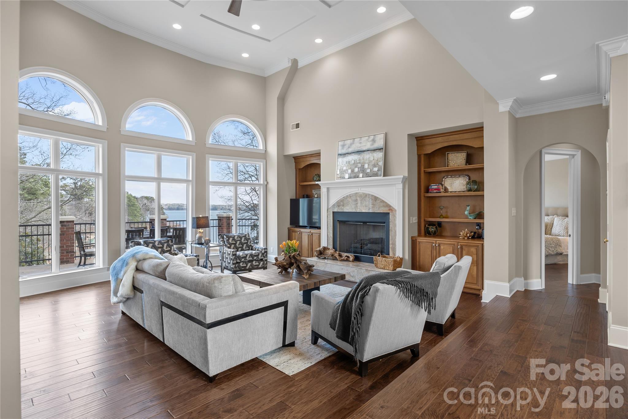 8052 Westbay Road Denver, NC 28037 - Photo 9 of 45 a living room with furniture and a fireplace