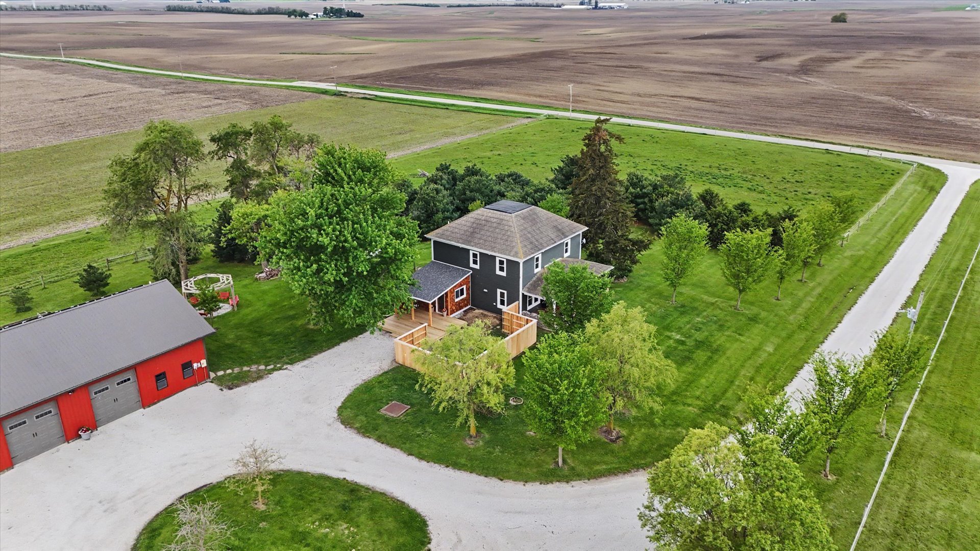 660 North 3000 E Road Strawn, IL 61775 - Photo 54 of 58 a aerial view of a house with a yard and potted plants