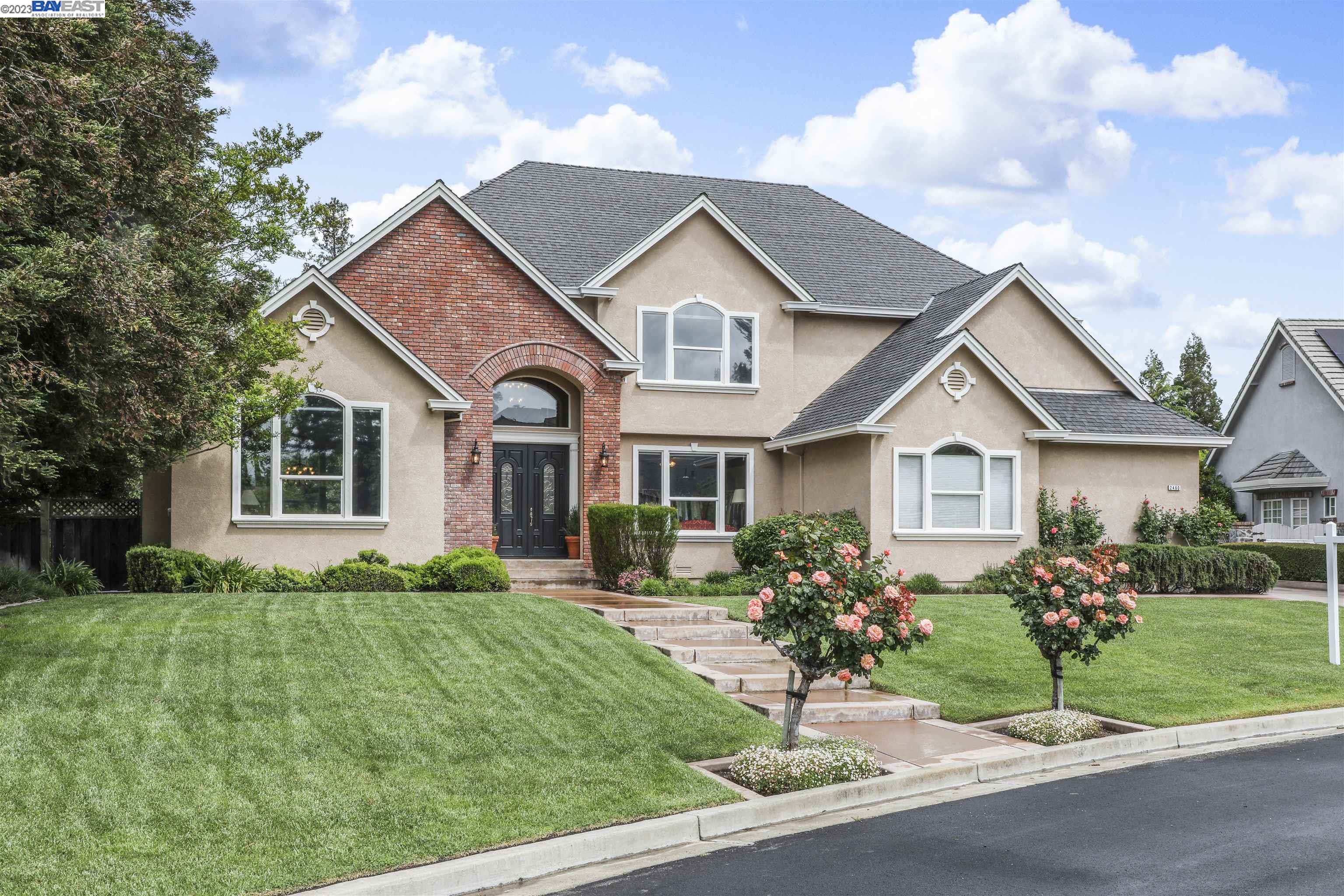 a front view of a house with a yard