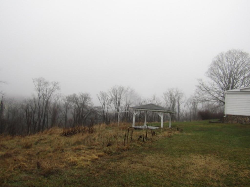 163 Poplar Road Avella, PA 15312 - Photo 11 of 32 a front view of a house with a yard