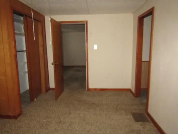 an empty room with a wooden door
