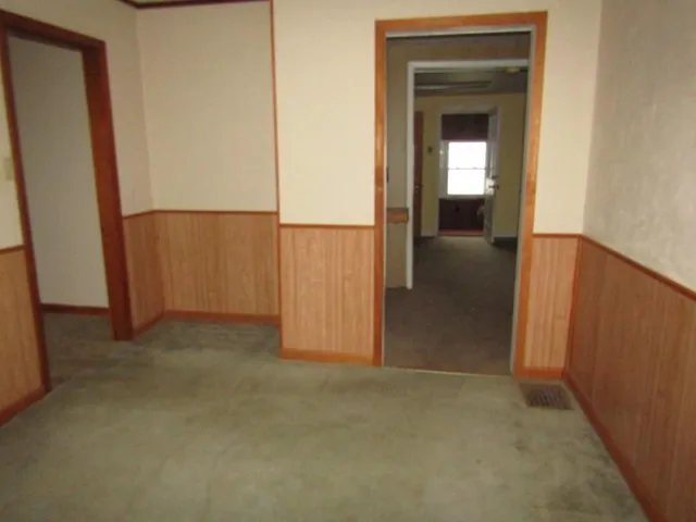 a kitchen with a refrigerator and a stove top oven