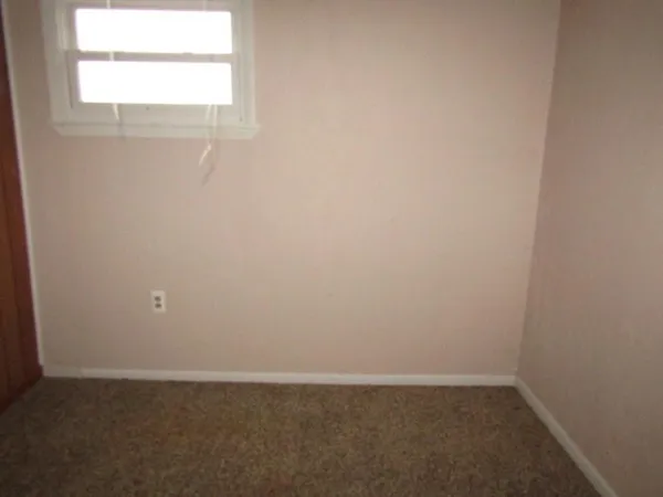 a bathroom with a sink and a window