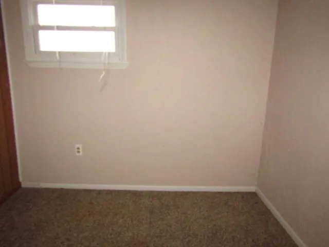 a bathroom with a sink and a window