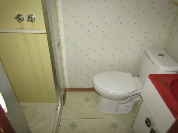 a view of a room with wooden walls