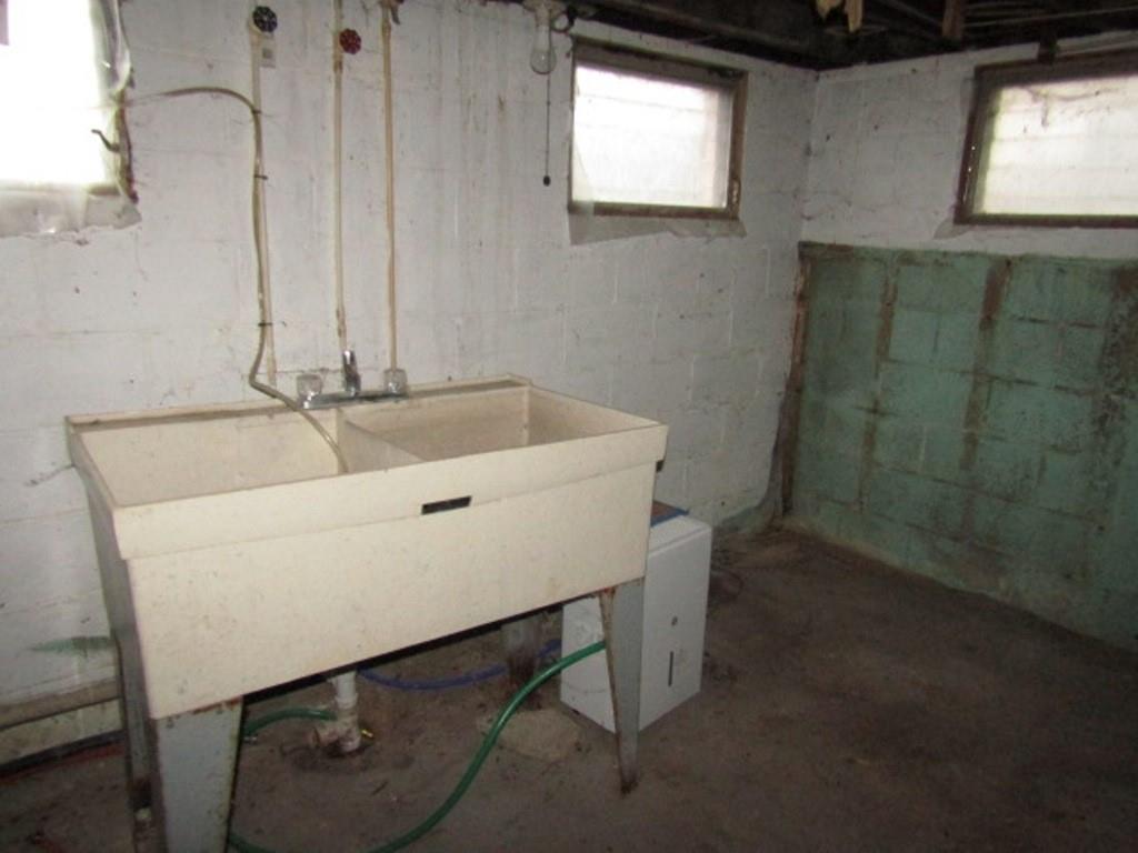 163 Poplar Road Avella, PA 15312 - Photo 31 of 32 a bathroom with a sink and a window